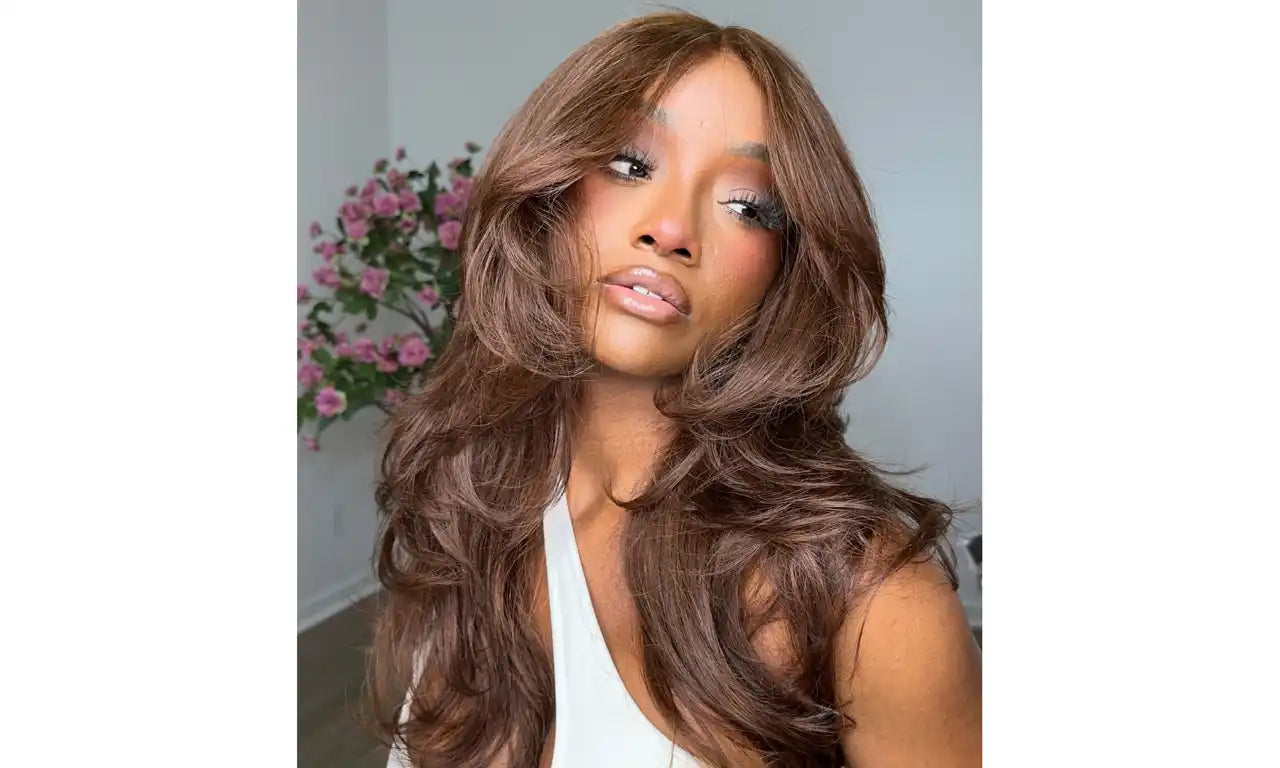 Long, flowing chocolate brown hair styled in loose waves.